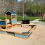 Villa Maxi sandbox with a playhouse in a playground