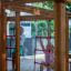 Children playing on the Chimpanzee wooden playhouse