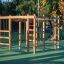 Chimpanzee wooden playhouse on a playground in a park.