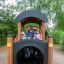 Children playing on a Train-themed playground structure.