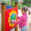 Child playing with the Clock playground equipment.