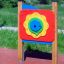 Colorful outdoor Clock play panel for children on playground.
