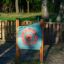 Outdoor wooden play clock for children in a park.