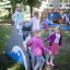 Children playing on the Dolphin Slide in a playground.