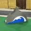 Dolphin Slide in a playground with green artificial turf