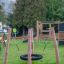 BNS Single Swing Robinia 4 Posts (BNS 90) on a playground