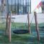 BNS Single Swing Robinia 4 Posts playground equipment in park setting.