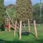BNS Single Swing Robinia 4 Posts (BNS 90) playground equipment in a park.