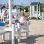 Children playing on the Sand & Water Play equipment in an outdoor sandbox.
