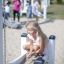 Girl playing with Sand & Water Play equipment at the playground.