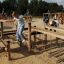 Children playing on the Poison Ground playground equipment outdoors.