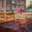 Child playing on the Poison Ground playground equipment in a residential area.
