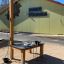 Outdoor Sand & Water Play Nature activity table for children in front of a school building.