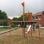 Mast climbing net in a playground setting.