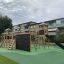 Playground structure with Explorer castle and slide.