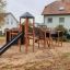 Children's outdoor Explorer castle with slide in a playground.