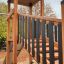 Wooden playground structure with slide named Explorer castle with slide.
