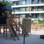 Explorer castle with slide wooden playground equipment in outdoor park area