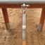 Close-up view of wooden Explorer castle with slide structure and metal connector details.