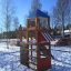Logo Tower with Firepole playhouse with slide in a snowy playground