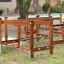 Course wooden playground climbing structure with ropes and platforms outdoors