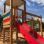 Logo Tower with Climbing Net playhouse with slide in the playground