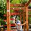 Child playing on Activity Center with Slide in a park.