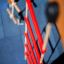 Red rope ladder on an Activity Center with Slide.