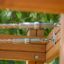 Close-up of cables and wooden frame of Activity Center with Slide.