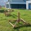 Atakama outdoor play equipment on grassy field near modern buildings