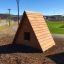 alt=Wooden Small House play structure in park