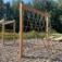 V-shape Net wooden playhouse in an outdoor playground.