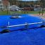 Single Seesaw on a Blue Playground Surface