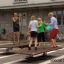 People enjoying the Spring Plate outdoor activity equipment.