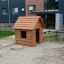Wooden Nature Playhouse in a playground.