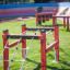 Trapezoidal wooden playground climbing structure for children.