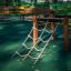 Trapezoidal climbing structure in a playground.