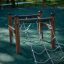 Children's playground climbing structure Trapezoidal with wooden frame and rope ladder.