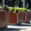 Oxford Flowerpot wooden planters with green and purple plants outside