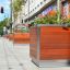 Oxford Flowerpot with plants on a city street.