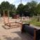 Outdoor playground with Honeycomb climbing structure and tunnel.