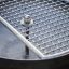 Stainless steel Grill with circular grate.