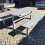 Modern outdoor Table & Bench HPL set on paving stones.