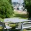 Outdoor Table & Bench Quadro HPL set in a green park scenery.