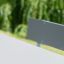 Grey table and bench from the Table & Bench 6 Seats HPL product line in a park setting.