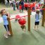 Children playing on the Somersault Double playground equipment.