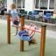 Children playing on Somersault Double playground equipment.