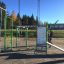 Information Board NAF outdoor fitness equipment with training instructions in a park setting.