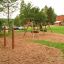 Playground equipment Somersault Triple with wooden frame and two tire swings.