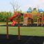 Somersault Triple playground equipment with slides and climbing structures on grassy area